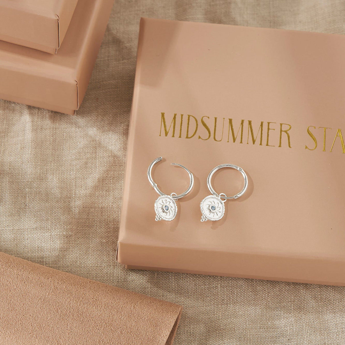 Helios Blue Topaz Huggies