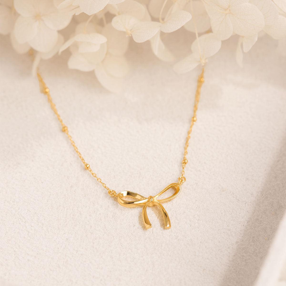 Disco Bow Necklace Gold
