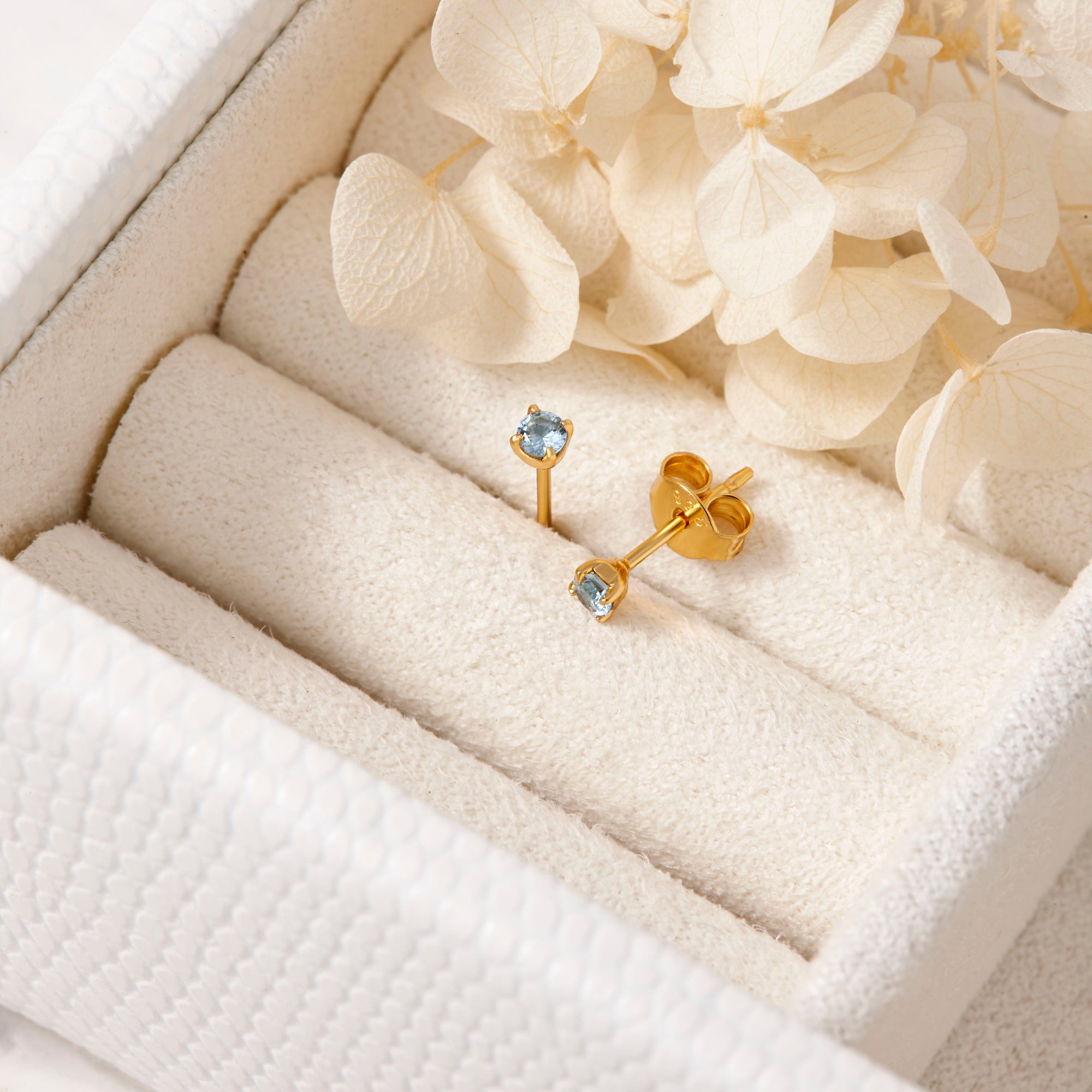 Delicate Blue Topaz Gold Studs