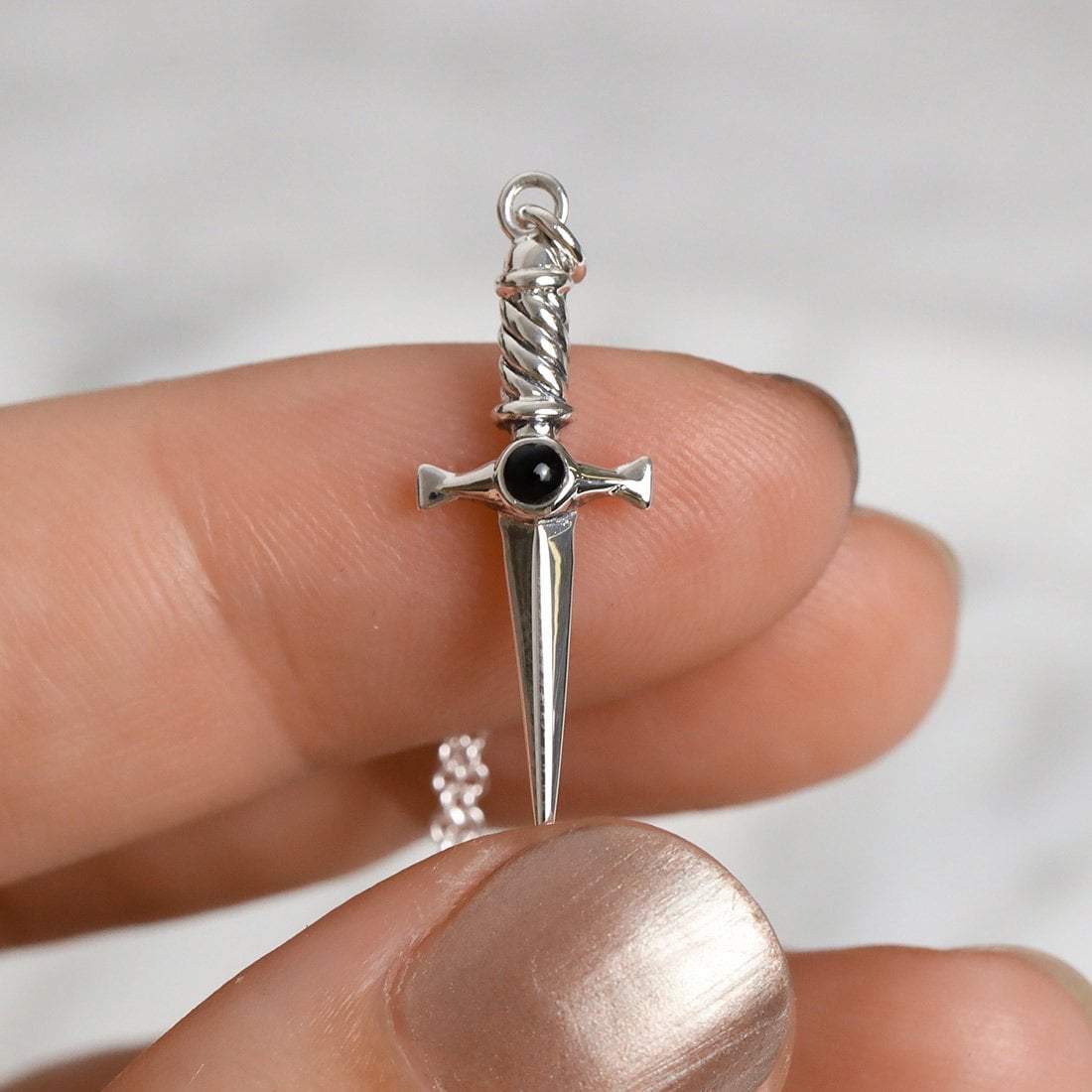 Cosmic Dagger Onyx Charm
