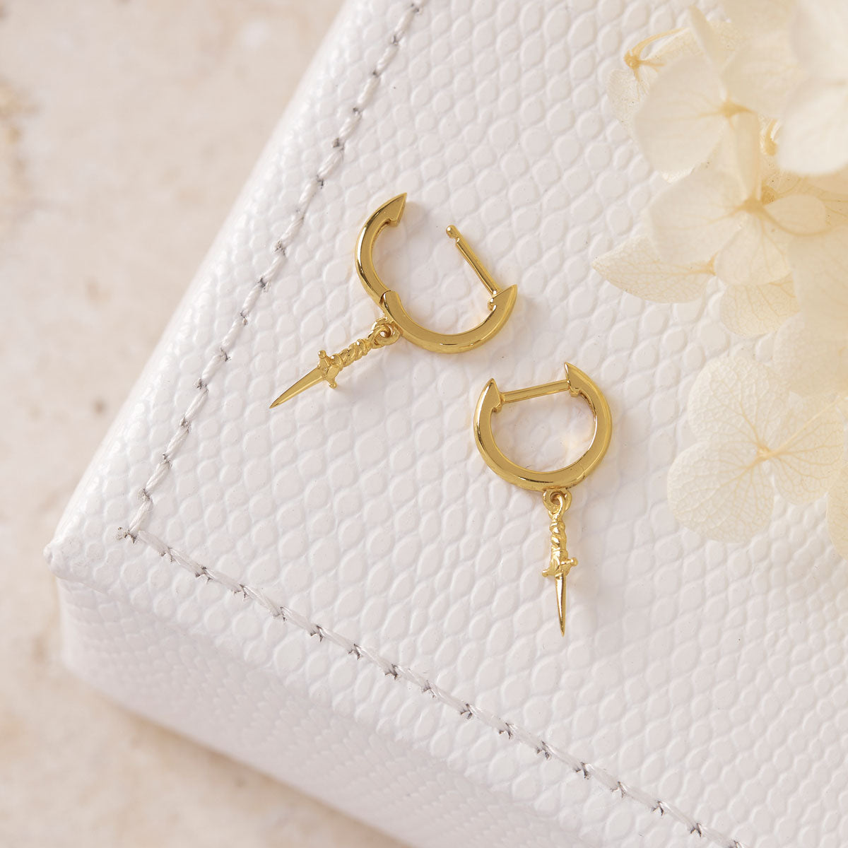 Cosmic Dagger Huggies Gold